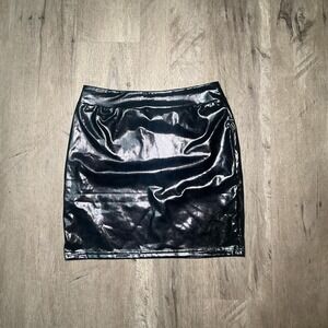 Black faux leather mini skirt with a zipper on the side. Size: S